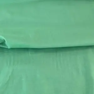 Detaliu material bumbac verde deschis pentru haine naturale Melissas