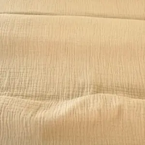 Material muselină organică bej Melissas – textură naturală și respirabilă