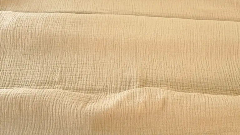material-muselina-bej-melissas Material muselină organică bej Melissas – textură naturală și respirabilă