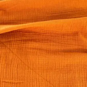 Material muselină organică portocalie Melissas – textură naturală și respirabilă